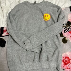 Grey smiley face crewneck